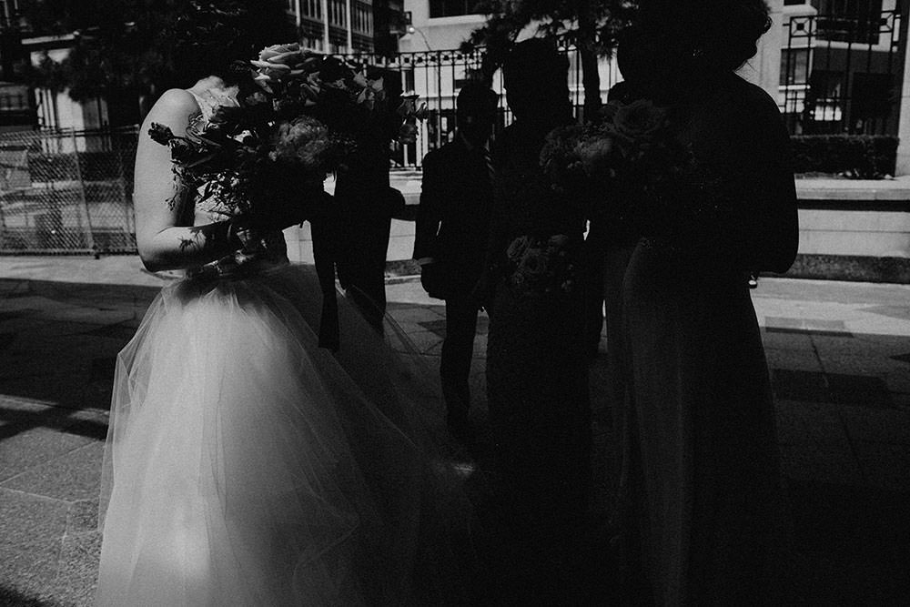 bridal party walks together between buildings downtown Toronto