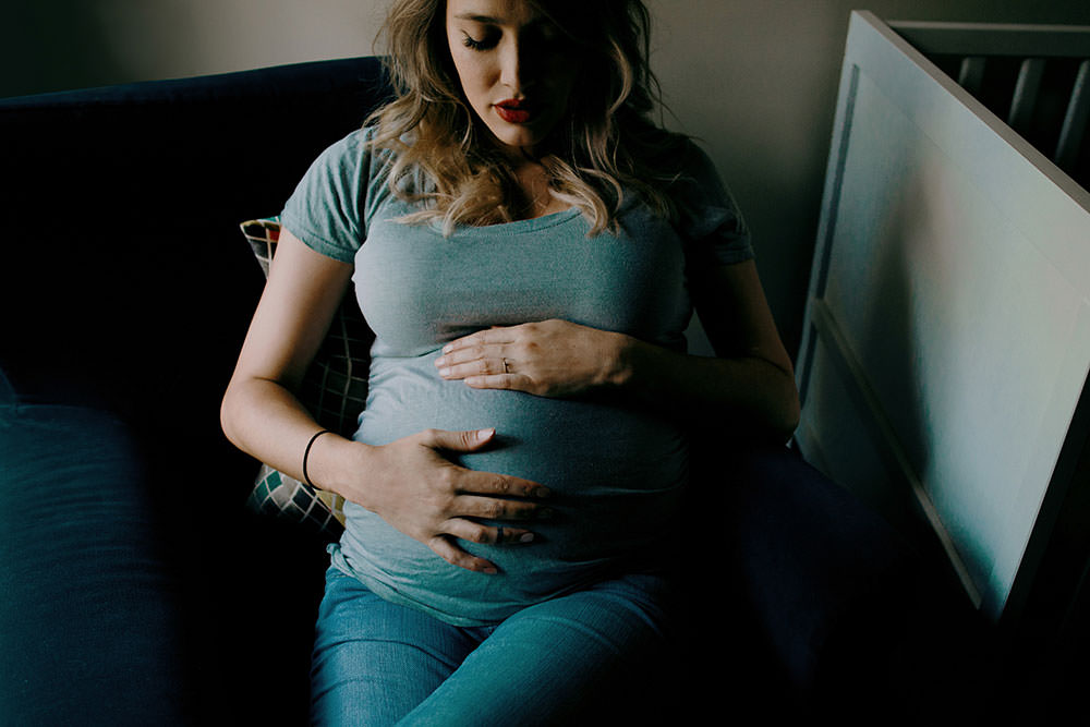 sudbury family portrait maternity mom holds belly