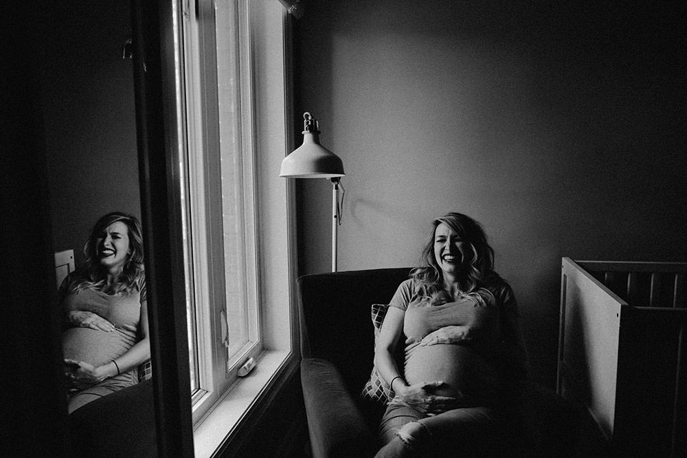 sudbury family portrait maternity mom holds belly laughing
