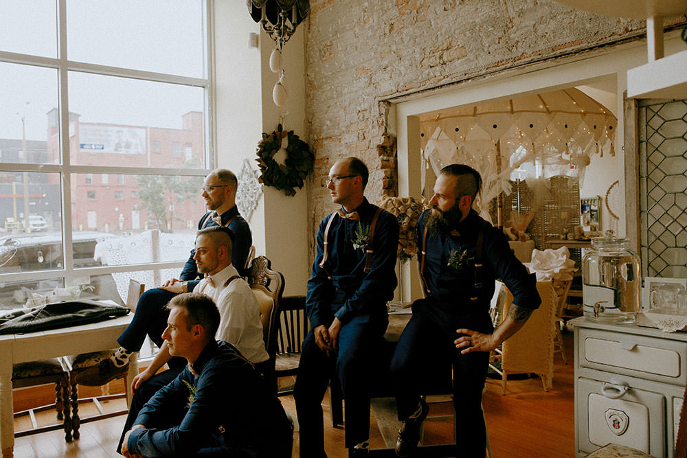 bridal party posing in downtown sudbury cedar nest cafe