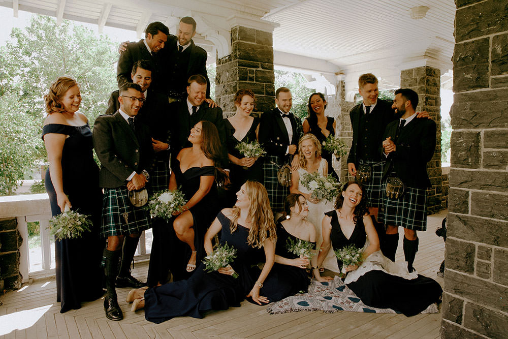 bridal party laughs together at idylwylde wedding