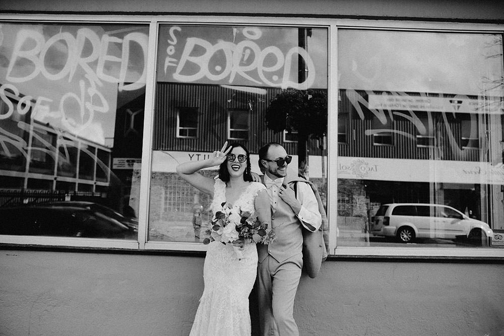 bride and groom posing downtown sudbury
