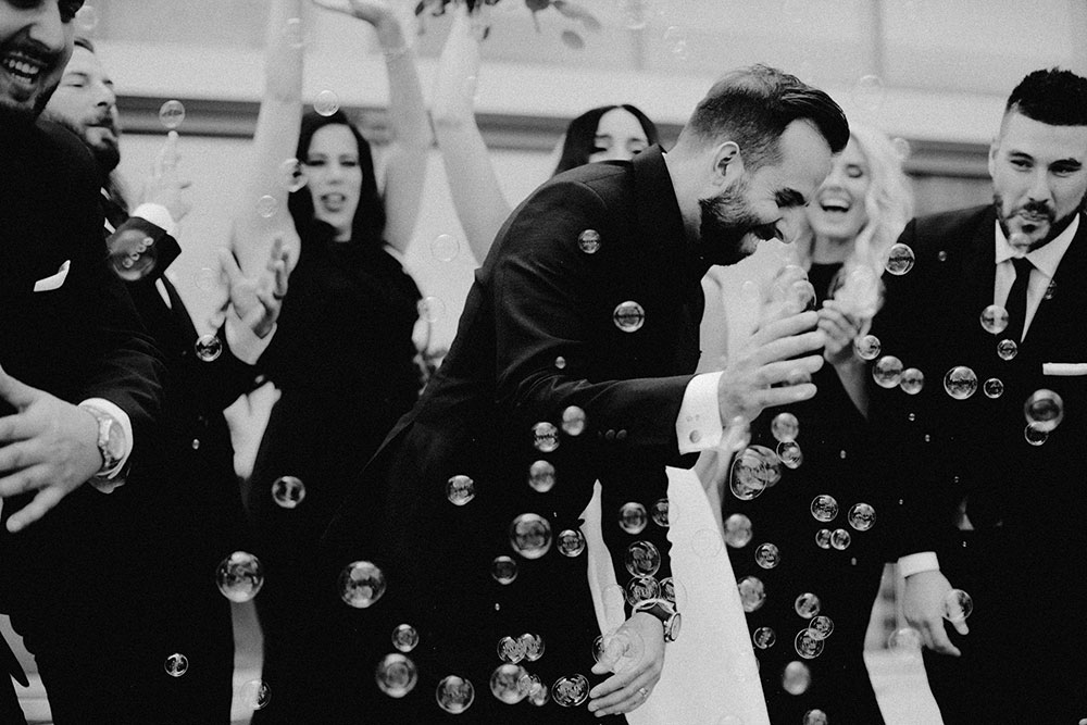 vaughan bride and groom candidly with bridal party