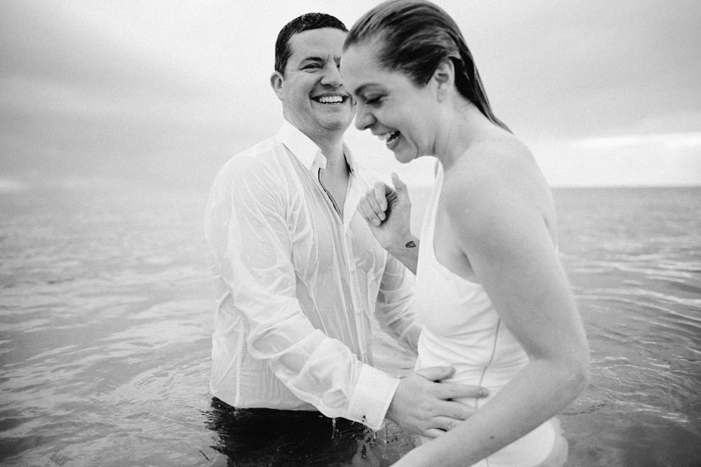 Royalton Riviera Cancun Wedding couple swim in ocean following morning