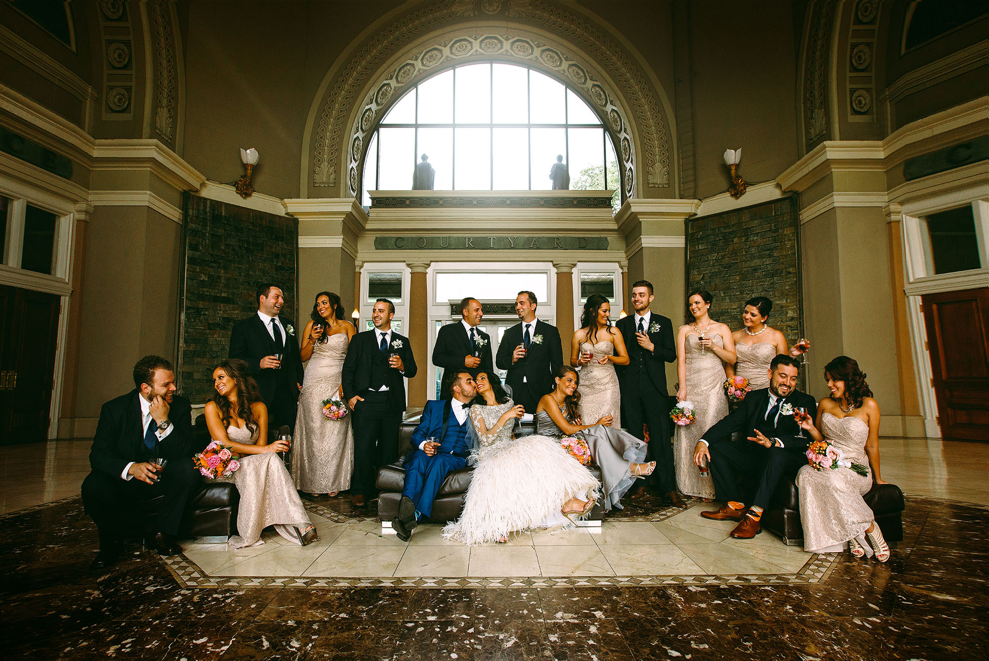 Toronto Liberty Grand Wedding Photography of Bridal Party laughing candidly together