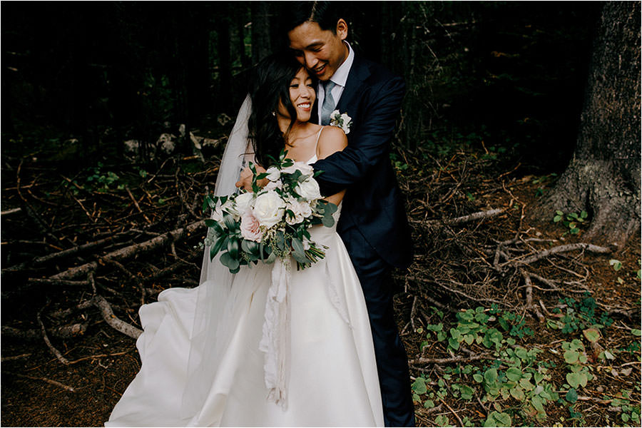 Wedding couple hold each other at the Fairmont Chateau Lake Louise in this beautiful photo