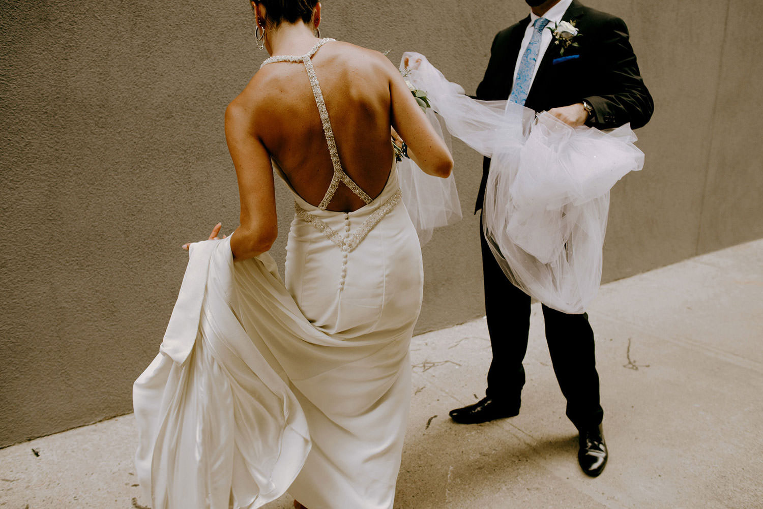 Sudbury Ontario Caruso Club wedding photography of bride twirling her gown around before the groom