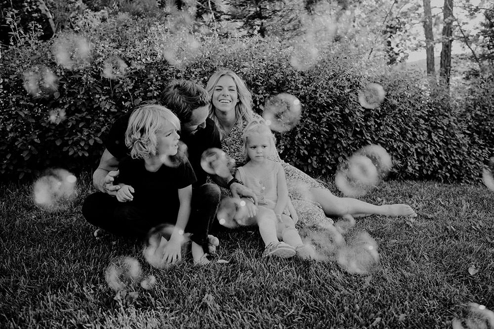 Andrew Desjardins and family chasing bubbles for Ontario family portrait