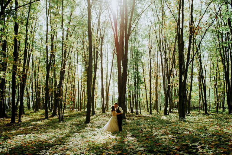 couple stands in magical forest in Manitoulin island wedding photography