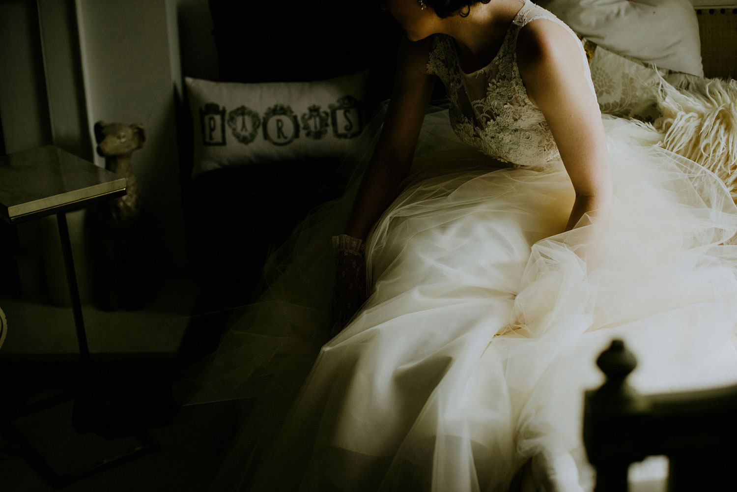 Eglington Grand Toronto Ontario Wedding photography of bride getting up from a vintage couch in a very lee Anne belter bridal gown