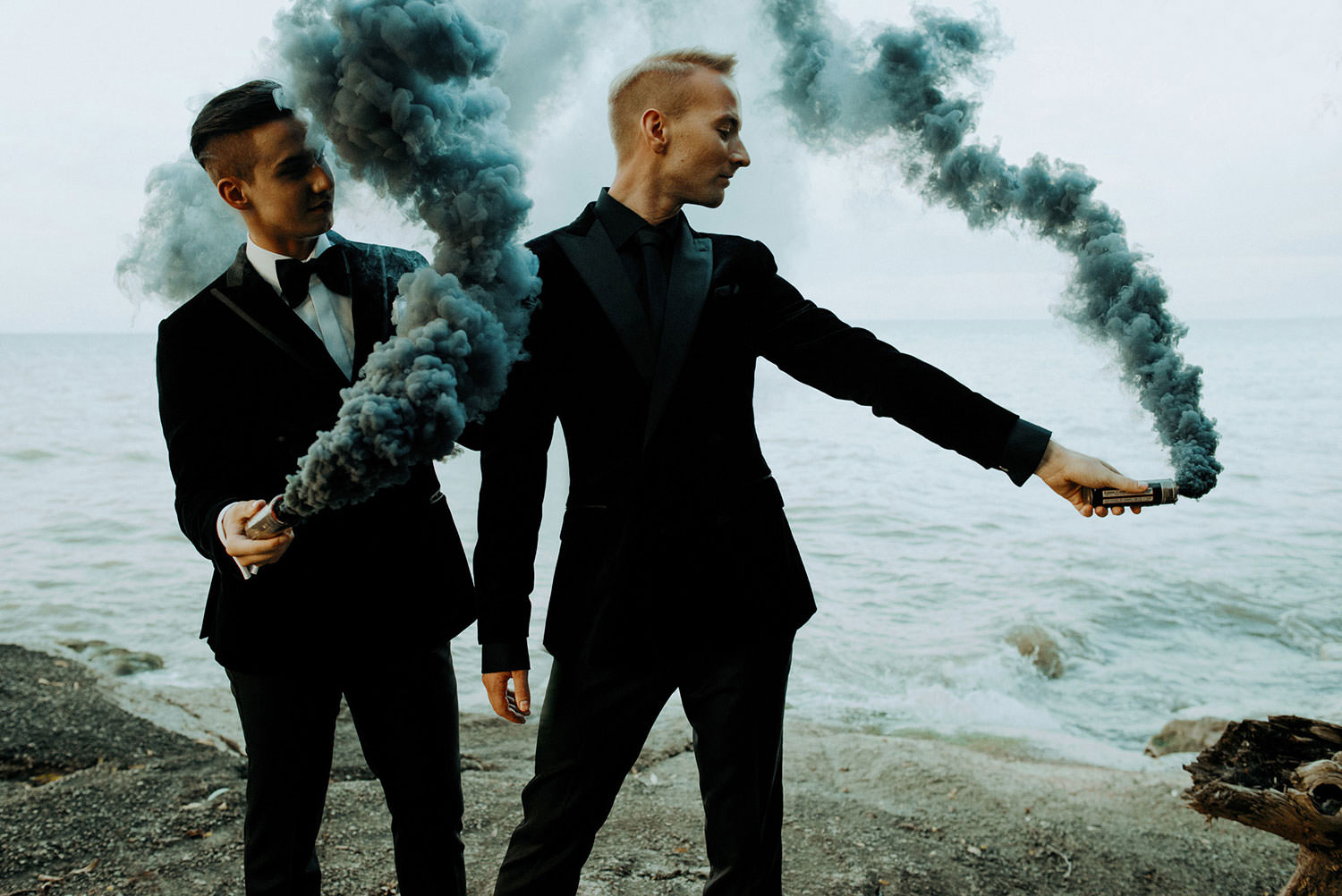 Derek Piquette and Mitchell Jackson Niagara on the Lake same sex wedding photography FLOFOTO the two men play with smoke bombs