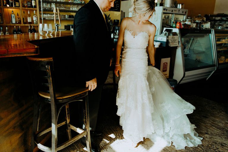 Sudbury Ontario Fromagerie Elgin street Wedding Photography of bride and groom gathering their things before they head out to the ceremony