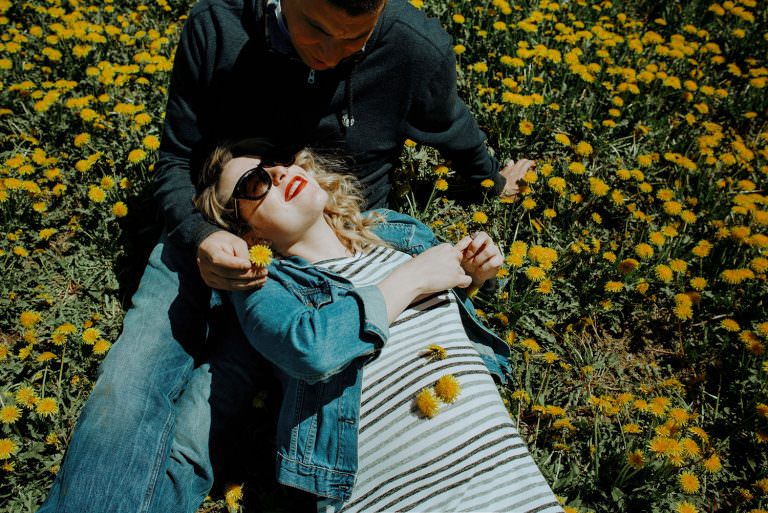 maternity photography in a field on dandelions in sudbury Ontario