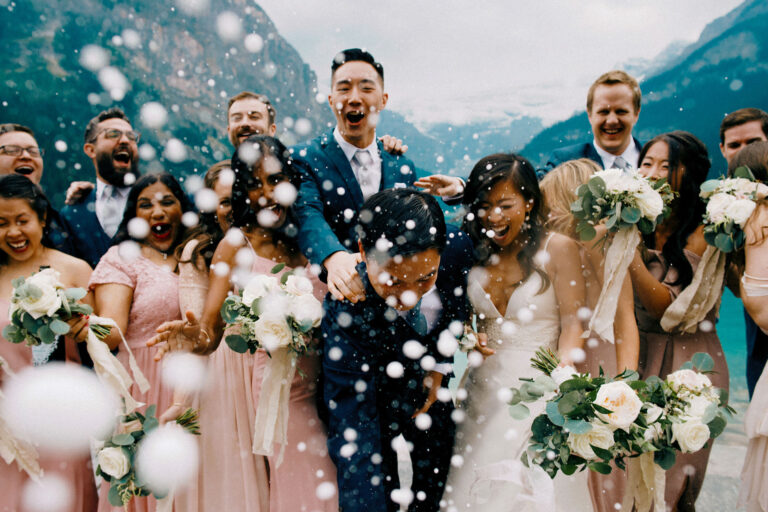 Fairmont Lake Louise Wedding Photography or bridal party doing a champagne pop for our Toronto Wedding Photography lenses