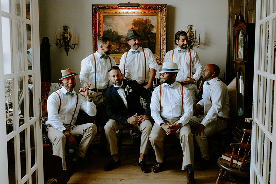 Toronto Wedding Photographer captures Groom & Groomsmen posing in an elegant room