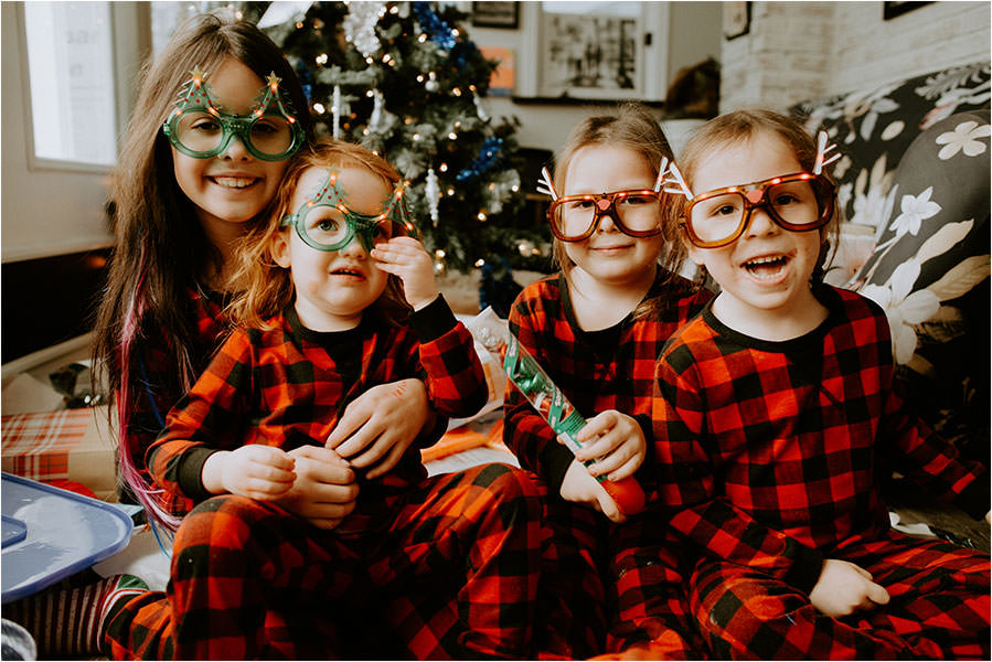 family portrait Sudbury Ontario cousins opening presents on Christmas