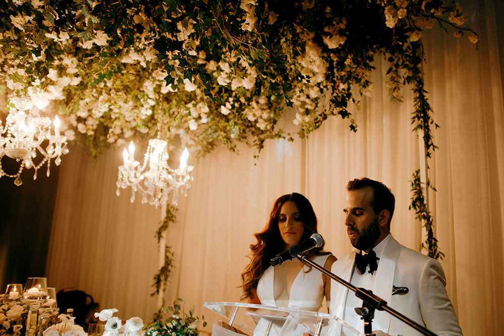 Best Wedding reception Photography of bride and groom giving speech