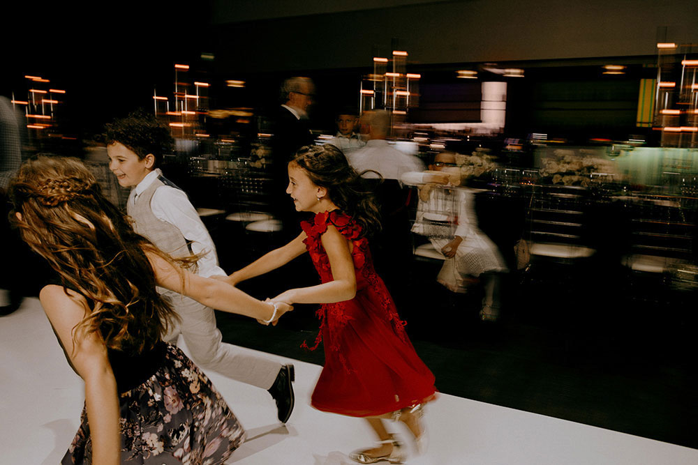 Best Wedding reception Photography of kids running around the dance floor