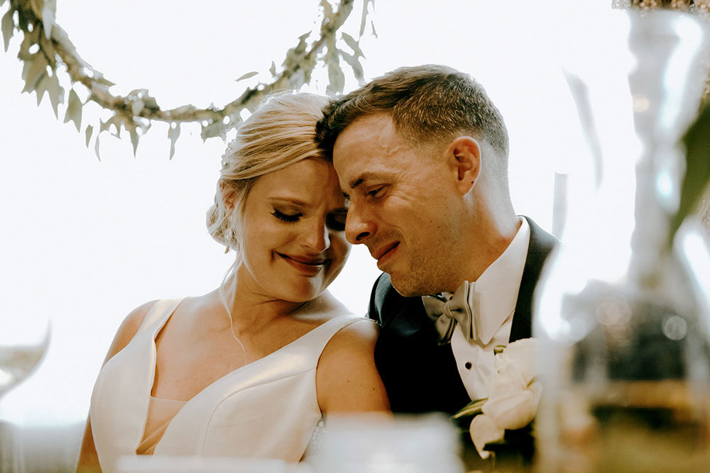 Best Wedding reception Photography of bride and groom crying together at speech