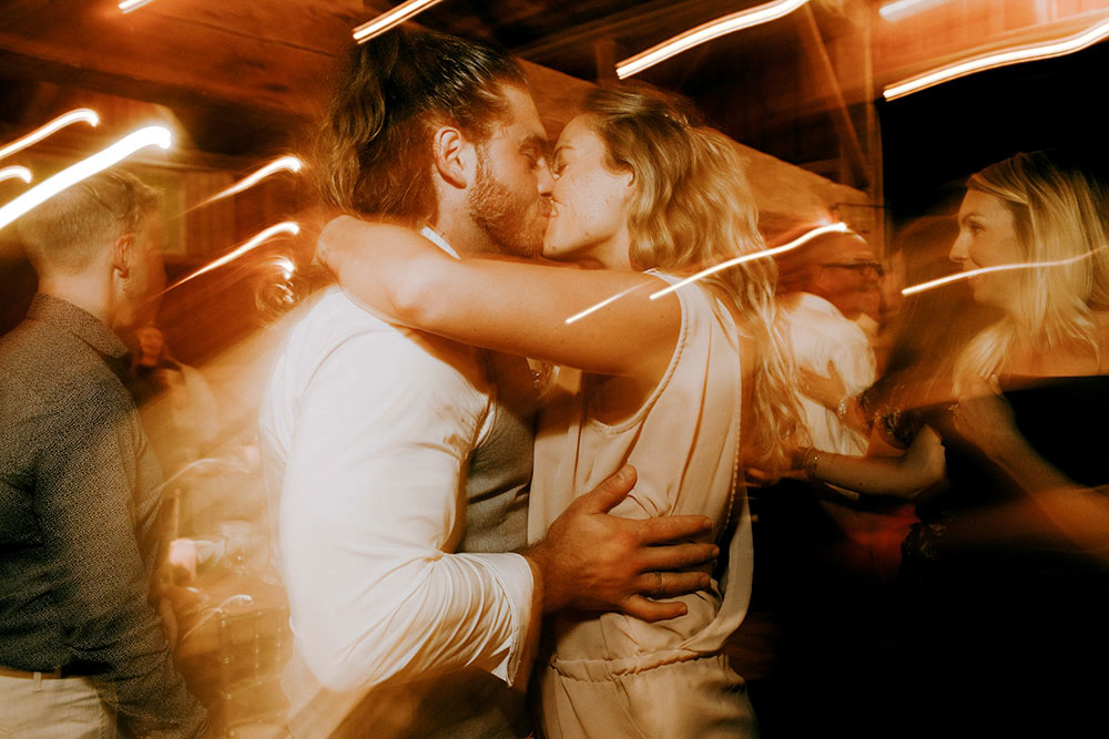 Best Wedding reception Photography of couple kissing on the dance floor