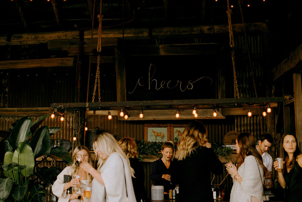 the bar at heritage view barns serves up cocktails at this wedding reception at the heritage view barn