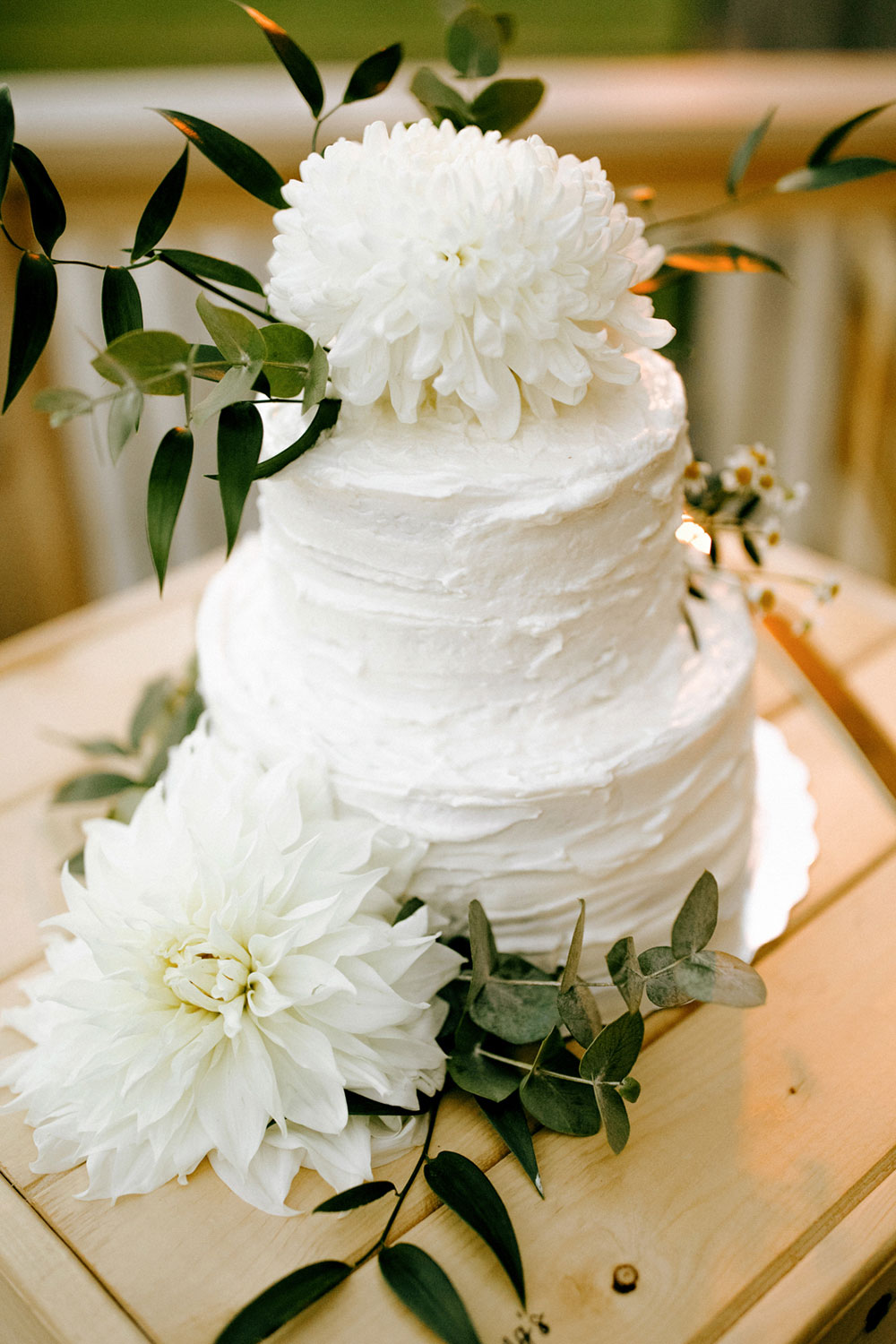 a wedding cake sits outside the heritage view barn