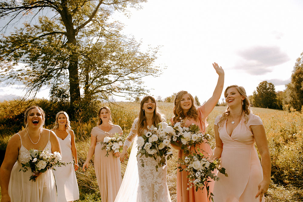 ladies laughing at golden hour at Heritage View Barn Wedding