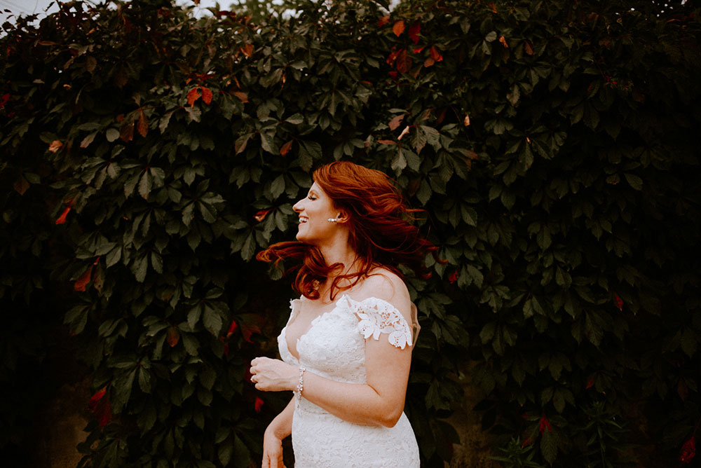 elora mill hotel elopement bride swinging hair back and forth