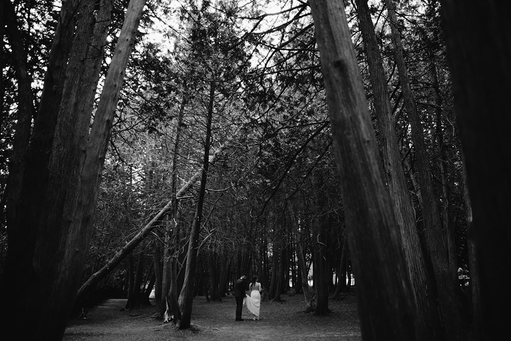 elora mill hotel elopement bride and groom walk through victoria park 