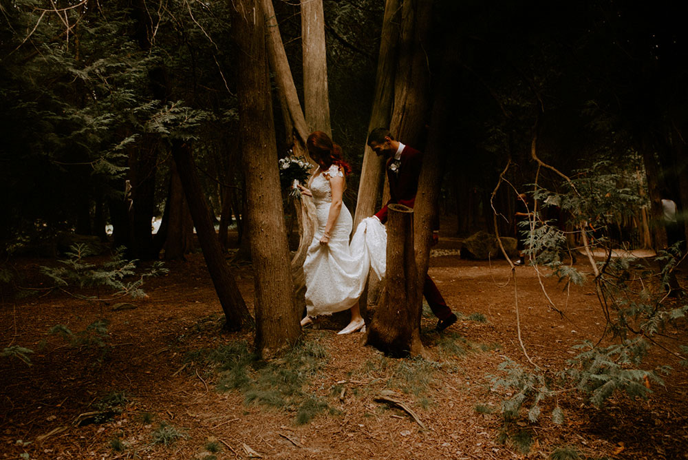 elora mill hotel elopement bride and groom walk through victoria park 