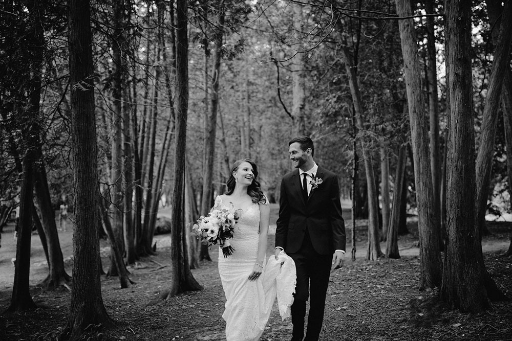 elora mill hotel elopement bride and groom walk through victoria park 