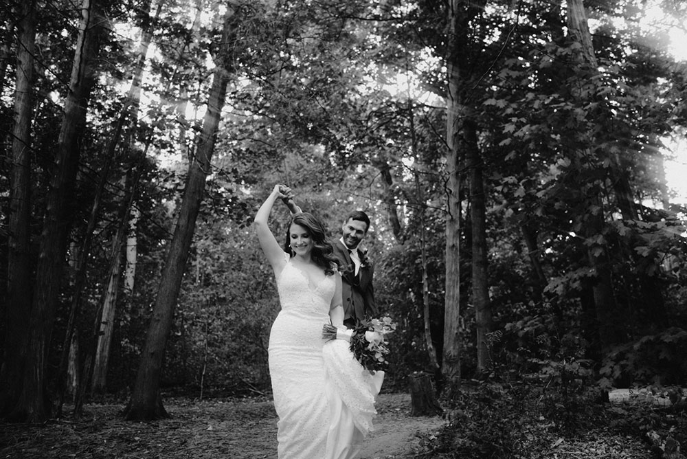 elora mill hotel elopement bride and groom walk through victoria park 