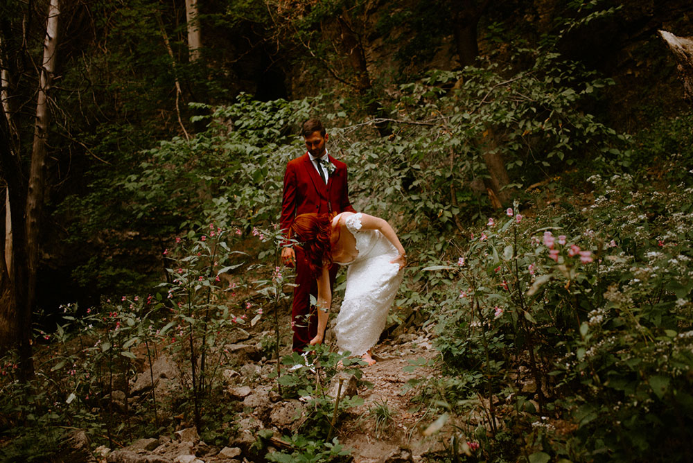 elora mill hotel elopement bride and groom walk through the victoria park gorge as husband and wife