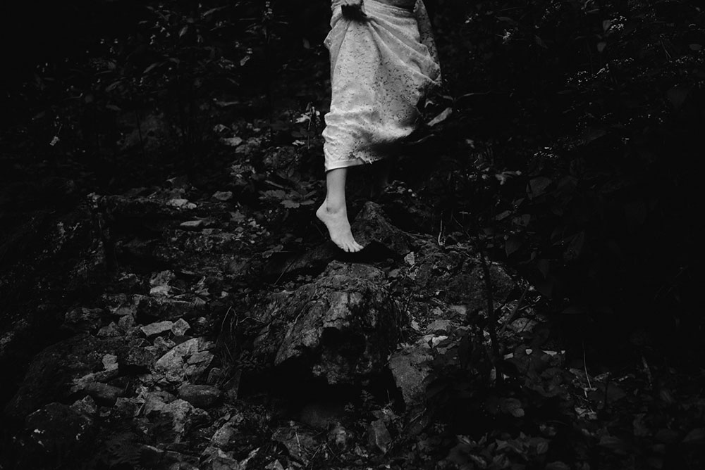 elora mill hotel elopement bride and groom walk through the victoria park gorge as husband and wife