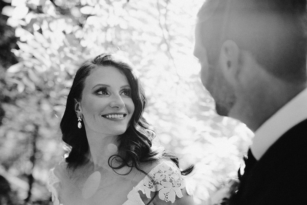 elora mill hotel elopement bride and groom walk through the victoria park gorge as husband and wife