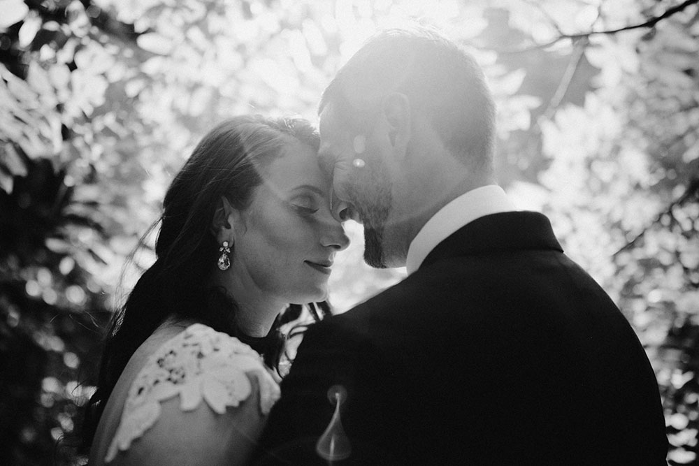 elora mill hotel elopement bride and groom walk through the victoria park gorge as husband and wife