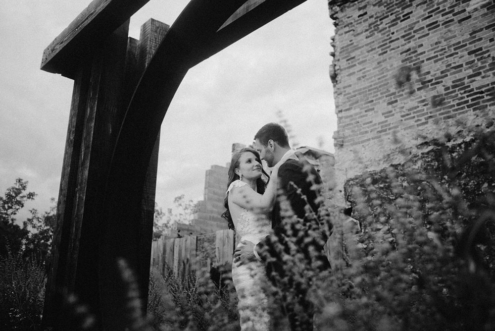 elora mill hotel elopement bride and groom dance through the downtown as husband and wife