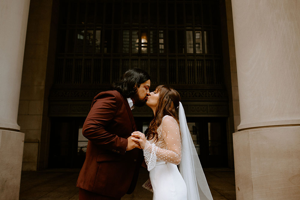 The Burroughes Toronto Wedding bride and groom kiss at Union Station