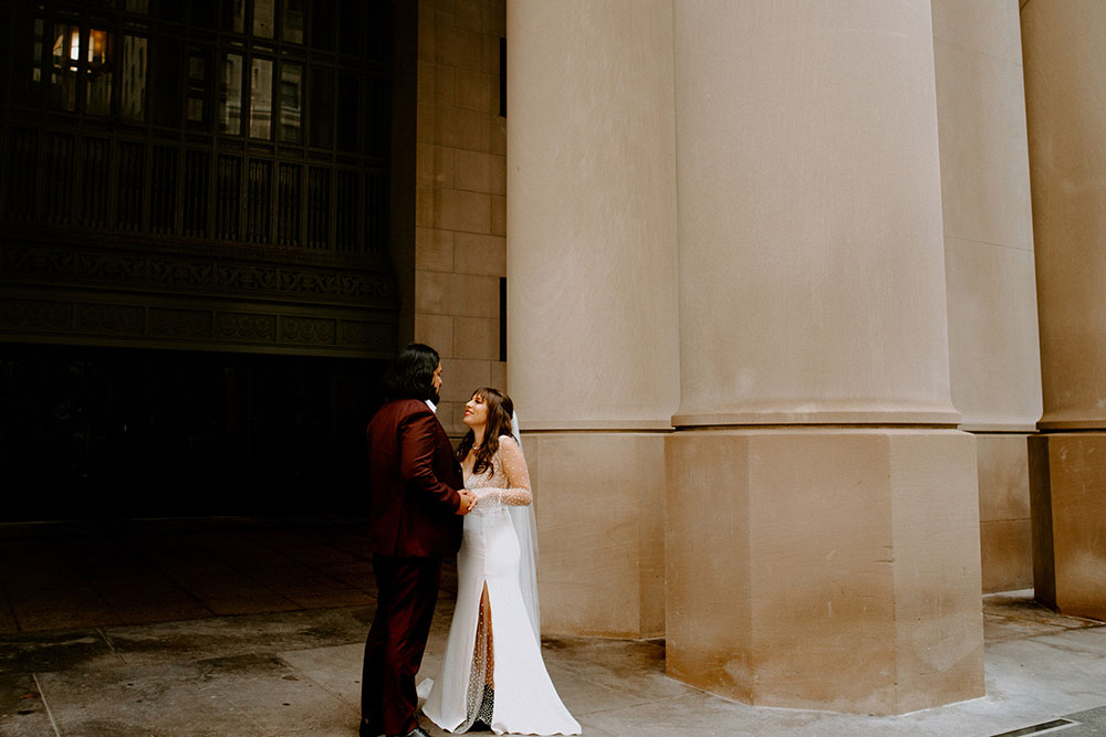 The Burroughes Toronto Wedding couple walk hand in hand at union station