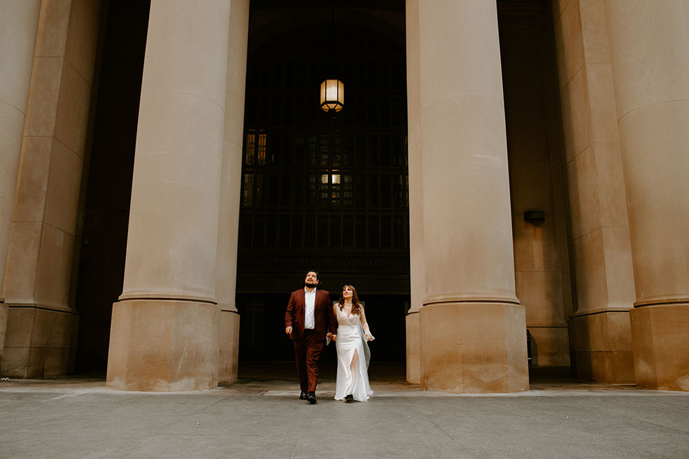 The Burroughes Toronto Wedding couple walk hand in hand at union station