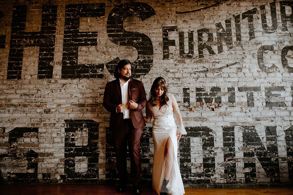 The Burroughes Toronto Wedding couple walk around the reception hall