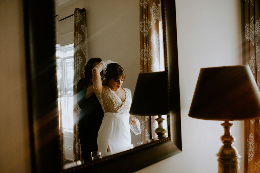 The Burroughes Toronto Wedding bride gets ready in mirror