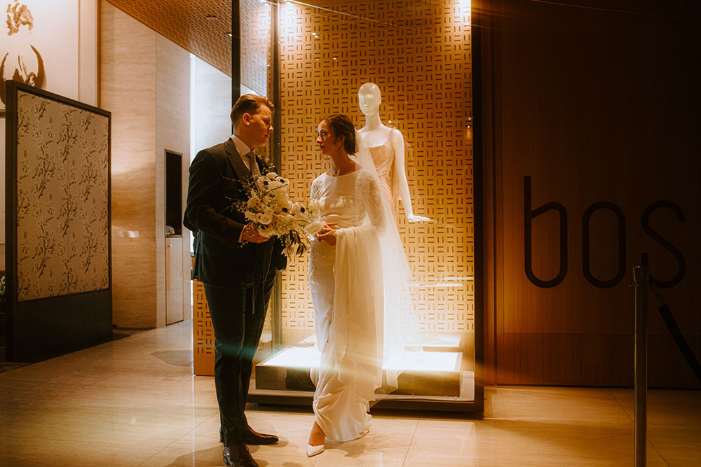 Shangri-La Hotel Toronto Wedding groom & bride stand in hotel lobby