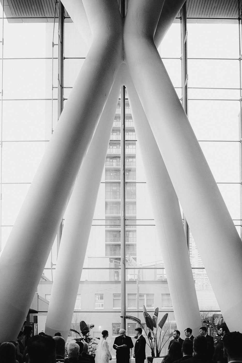 Ricarda's Atrium Toronto Wedding bride & groom stand at alter 