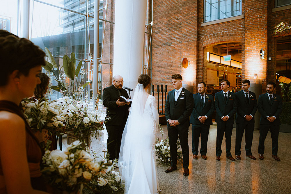 Ricarda's Atrium Toronto Wedding bride & groom stand at alter 