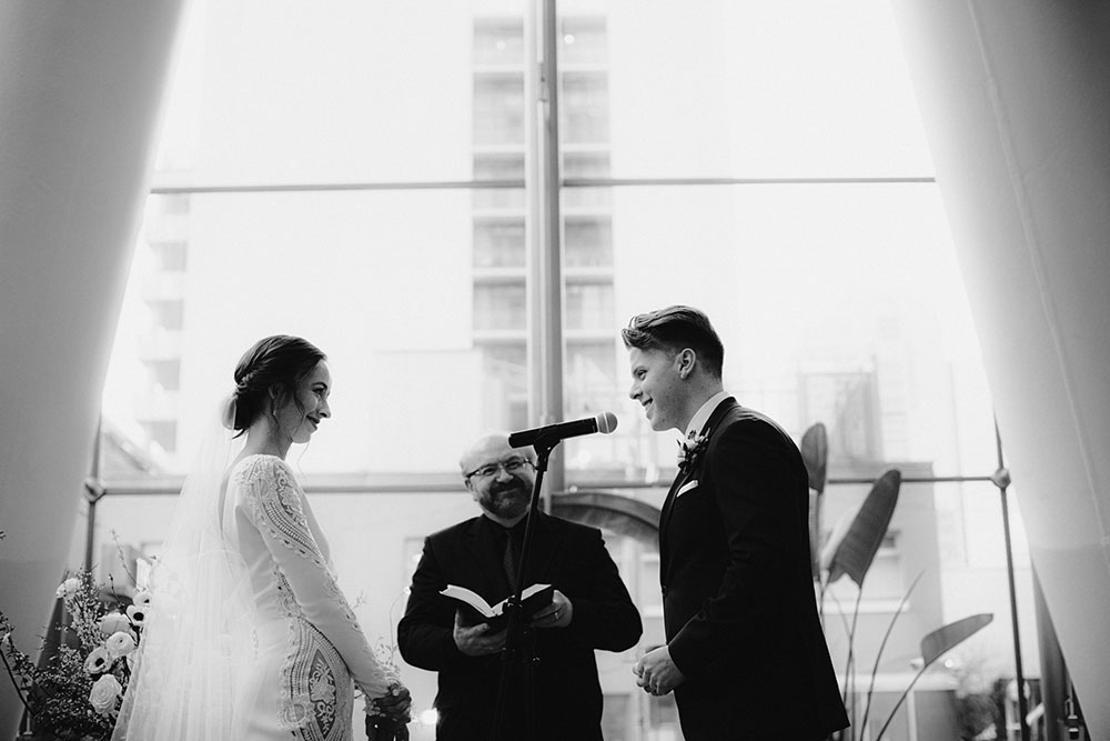 Ricarda's Atrium Toronto Wedding bride & groom stand at alter 