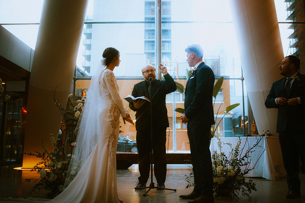 Ricarda's Atrium Toronto Wedding bride & groom stand at alter 