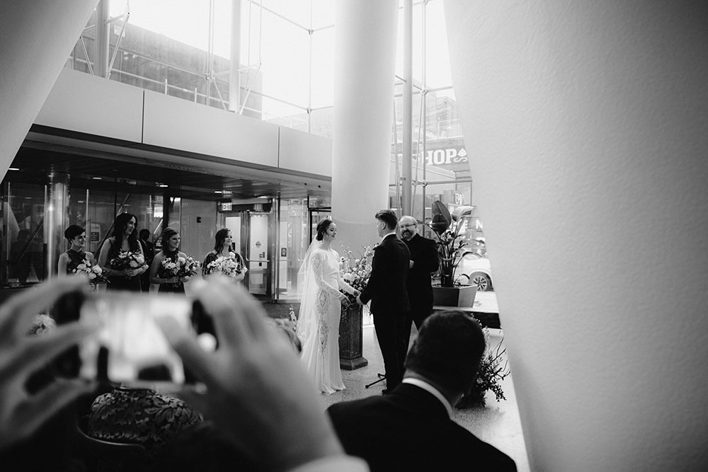 Ricarda's Atrium Toronto Wedding bride & groom stand at alter 