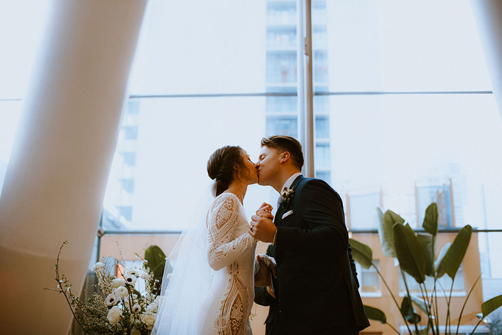 Ricarda's Atrium Toronto Wedding bride & groom stand at alter 