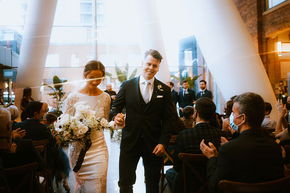 Ricarda's Atrium Toronto Wedding bride & groom stand at alter 